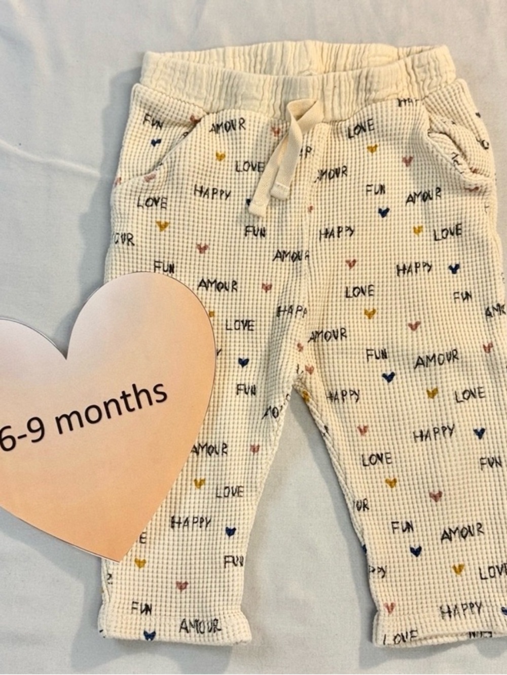 Zara Cream Waffle Knit Baby Pants with Multicolor Hearts and Words